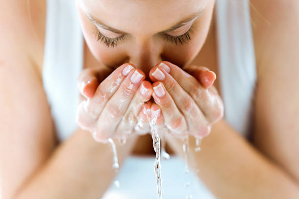 Runner refilling a bottle at a fountain